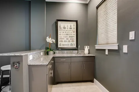 a bath room with sink and window