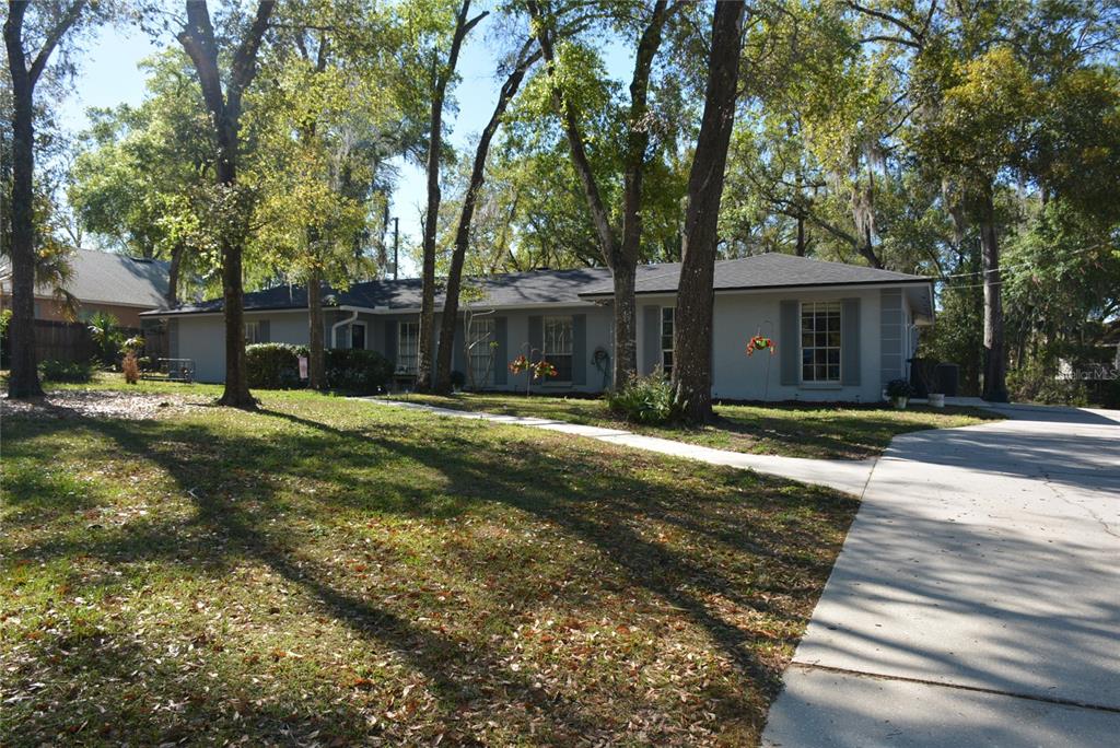 308 Tangerine Street Altamonte Springs, FL 32701 - Photo 4 of 58 Spacious yard with lots of trees * Brand new Roof and Gutters in 2024!