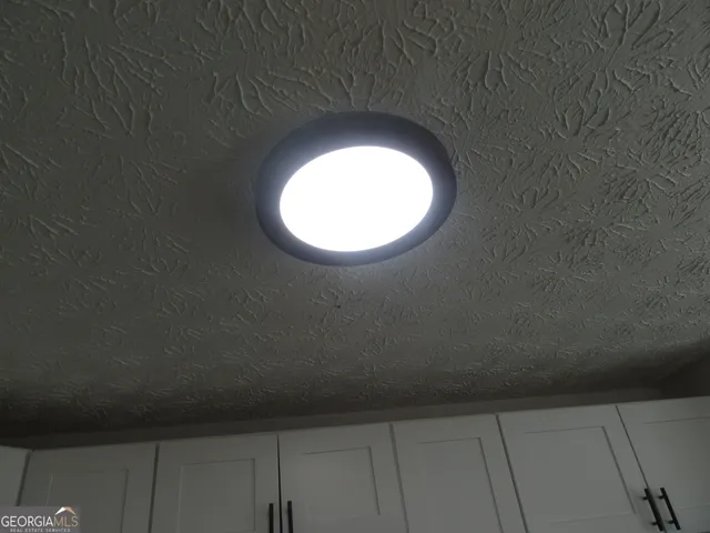 an empty room that has a window in it