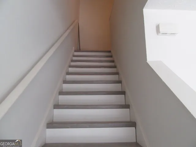 a view of a hallway with a door