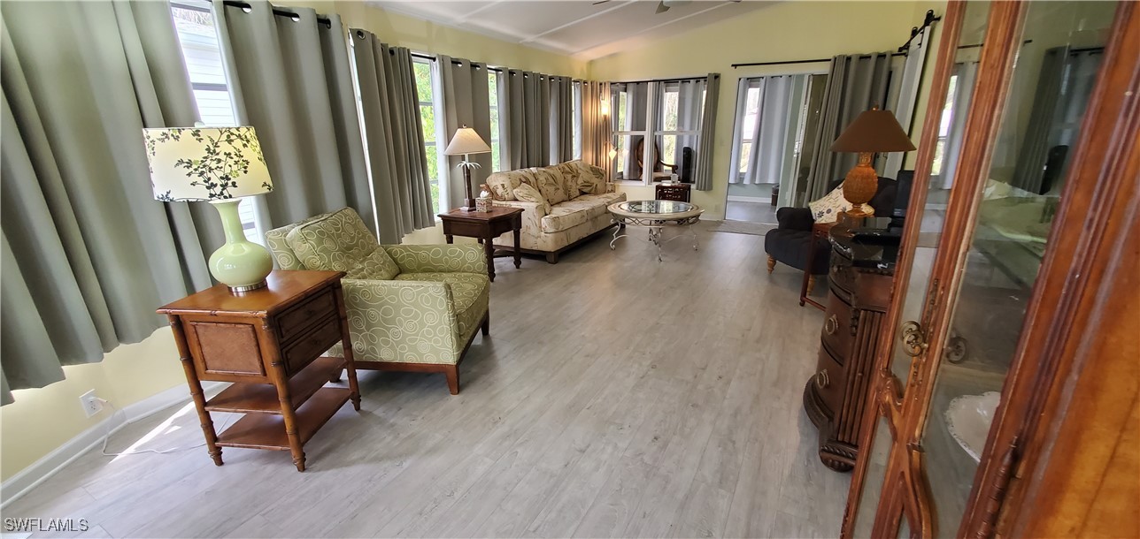 10823 Ani Circle Estero, FL 33928 - Photo 7 of 31 a living room with furniture and a large window