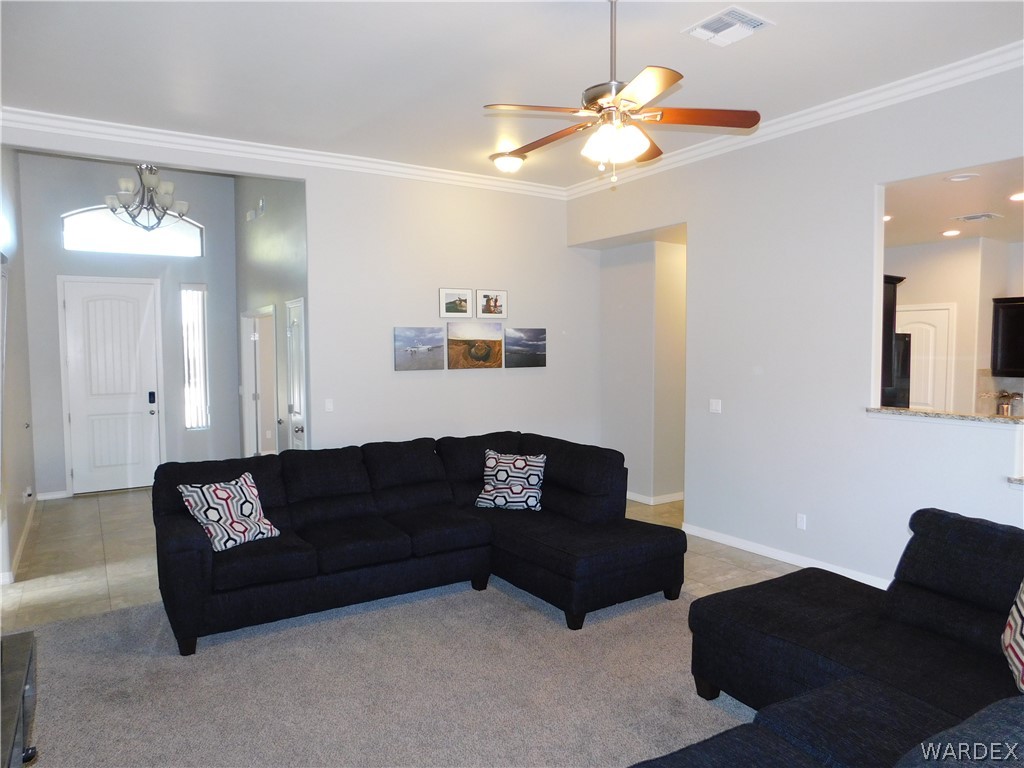 3370 South Ridge Avenue Bullhead City, AZ 86429 - Photo 26 of 56 a living room with furniture and a lamp