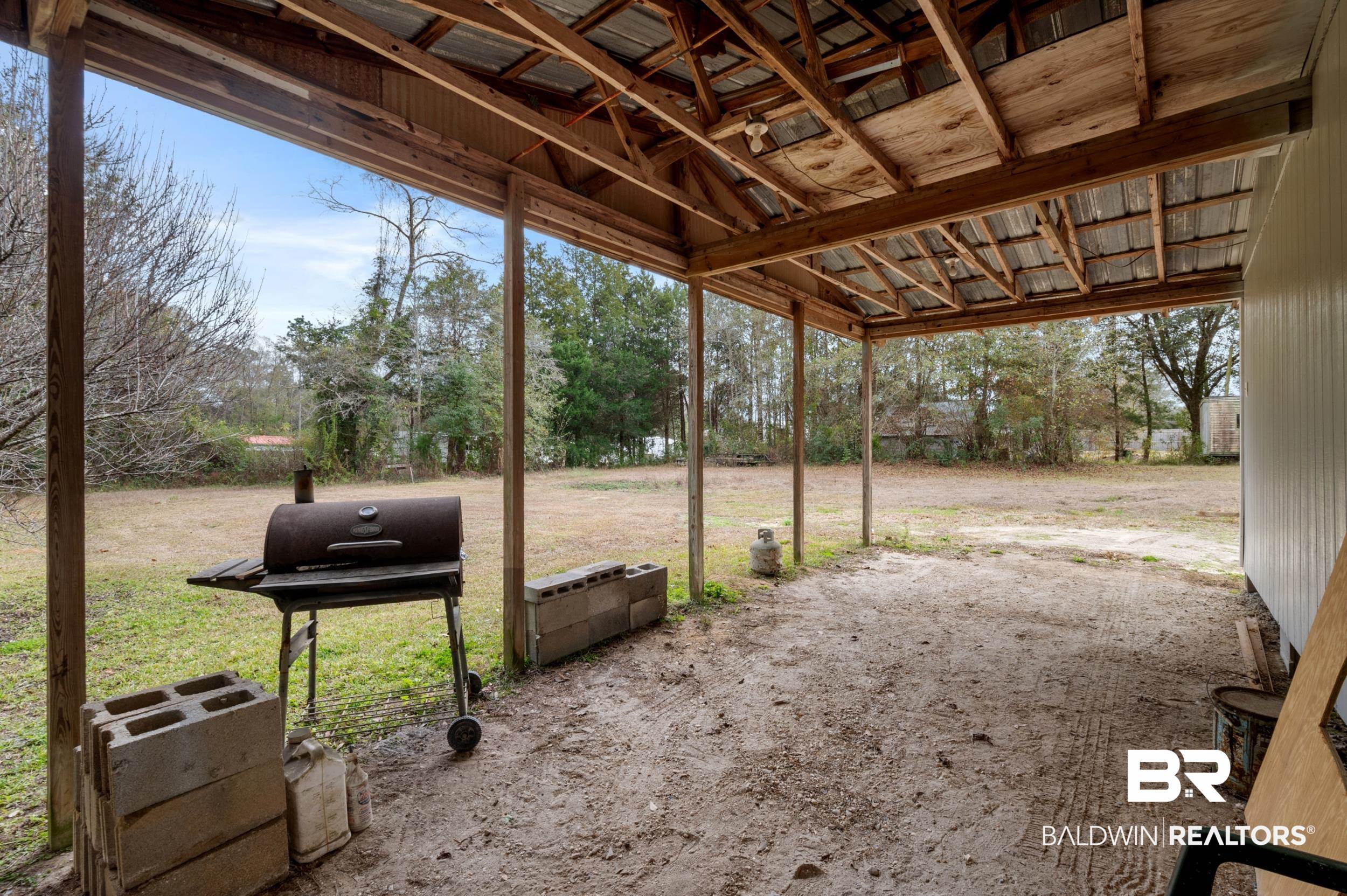 35780 Spring Road North Stapleton, AL 36578 - Photo 35 of 41 View of yard featuring a patio area