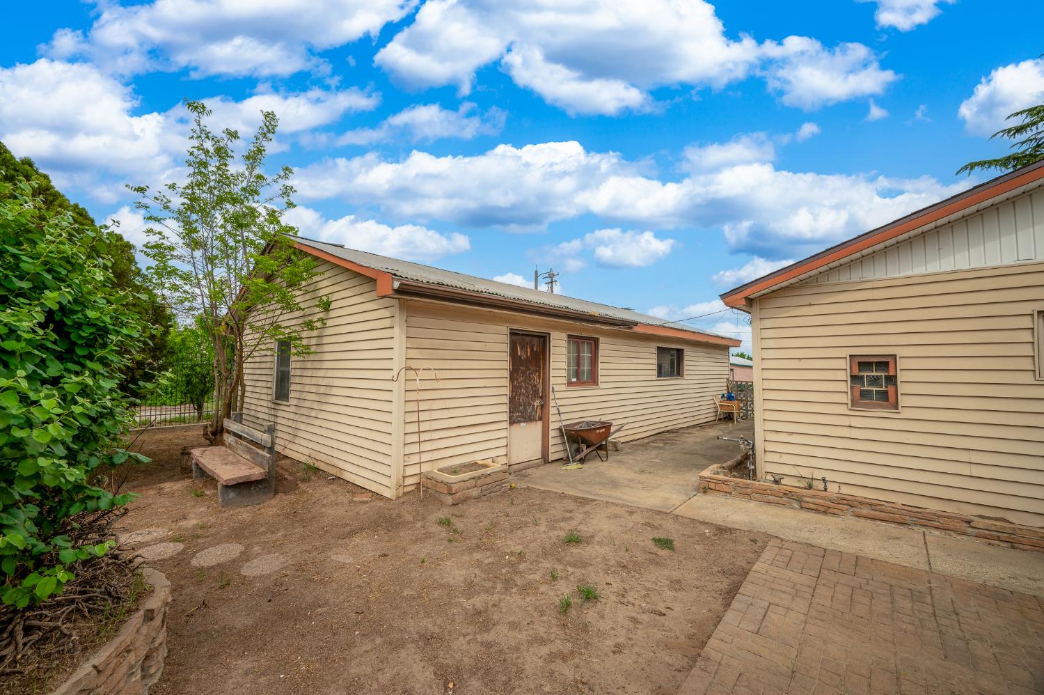 13230 4th Street Hickman, CA 95323 - Photo 19 of 54 a view of a house with a backyard