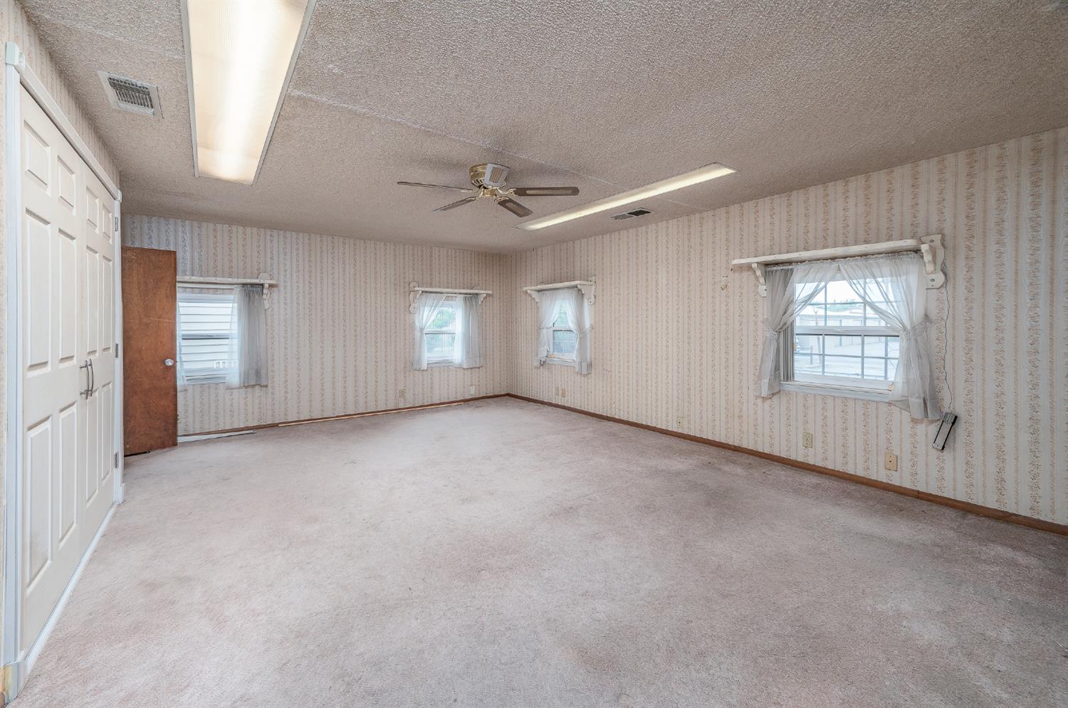 13230 4th Street Hickman, CA 95323 - Photo 2 of 54 a view of an empty room with windows
