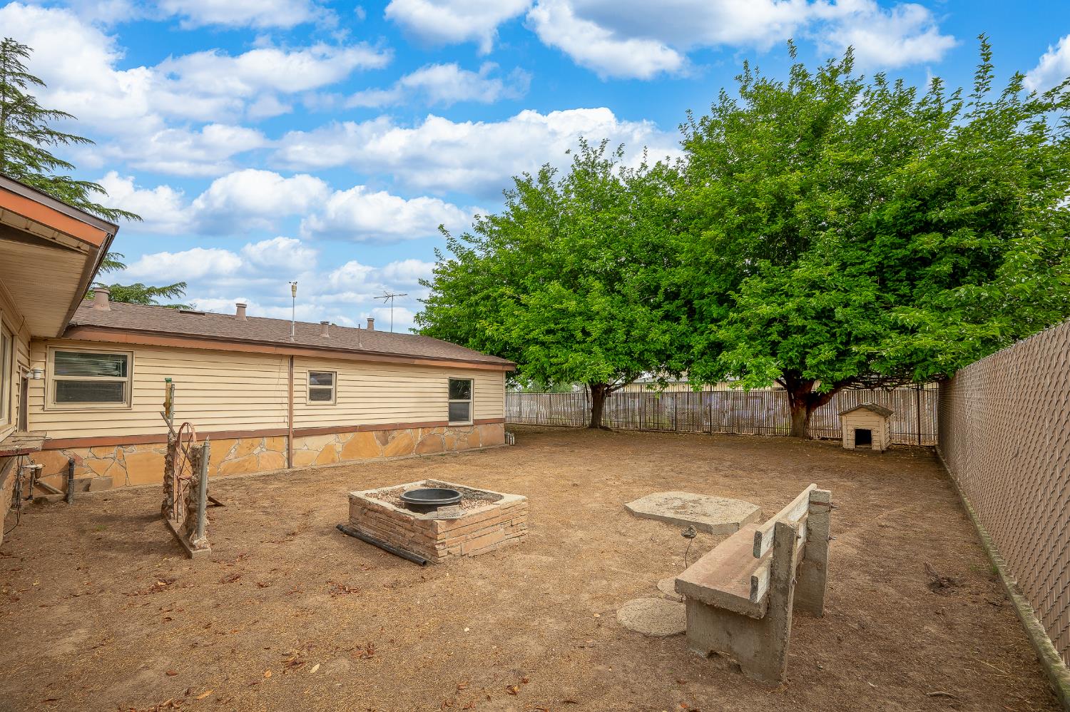 13230 4th Street Hickman, CA 95323 - Photo 21 of 54 a view of a backyard with a sitting area