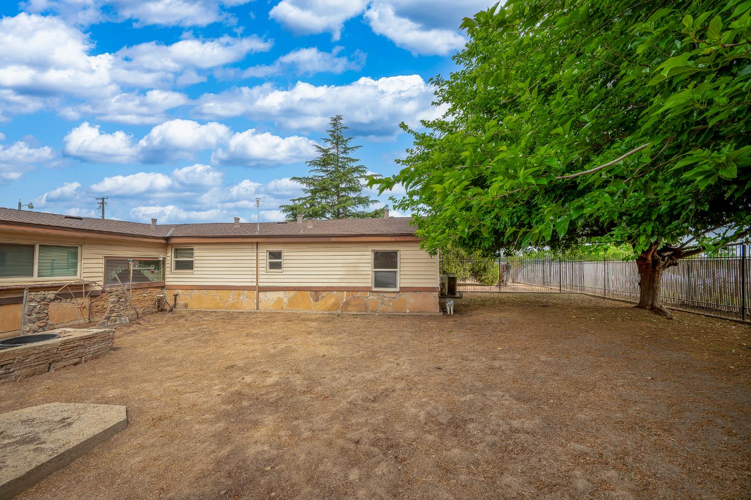 13230 4th Street Hickman, CA 95323 - Photo 23 of 54 a view of a house with a yard and garage