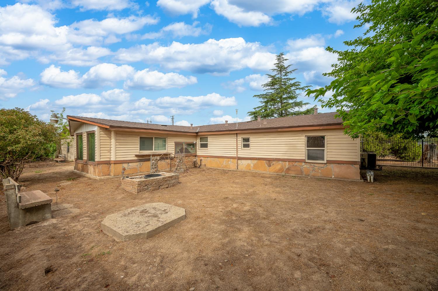 13230 4th Street Hickman, CA 95323 - Photo 24 of 54 front view of a house with a patio