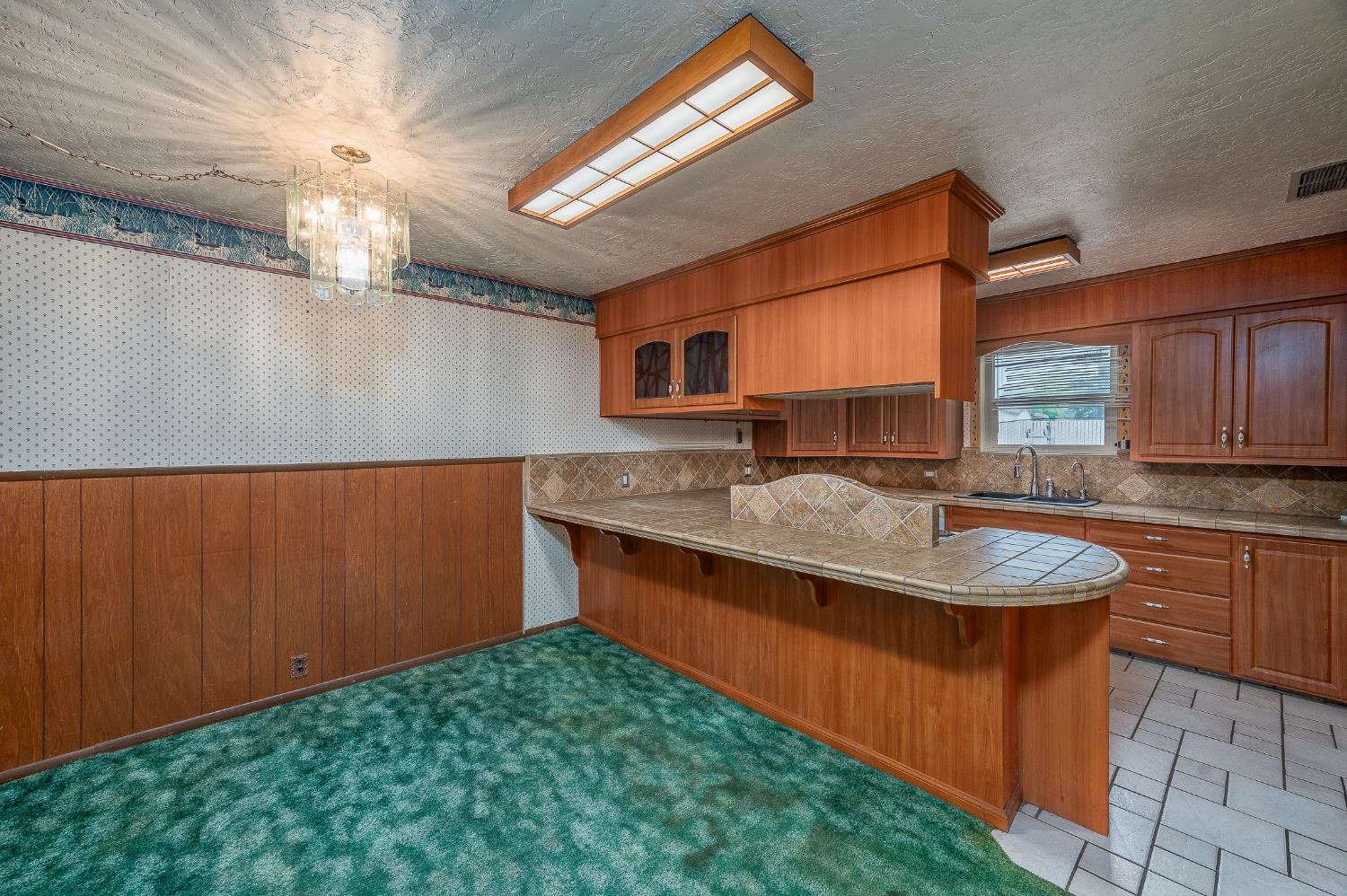 13230 4th Street Hickman, CA 95323 - Photo 30 of 54 a kitchen with stainless steel appliances granite countertop a sink window and cabinets