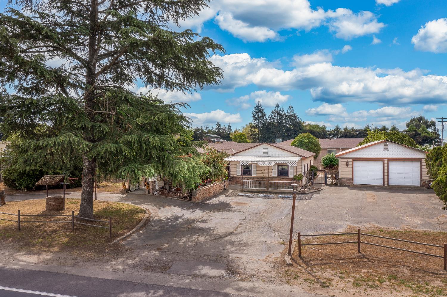13230 4th Street Hickman, CA 95323 - Photo 3 of 54 a front view of a house with a yard