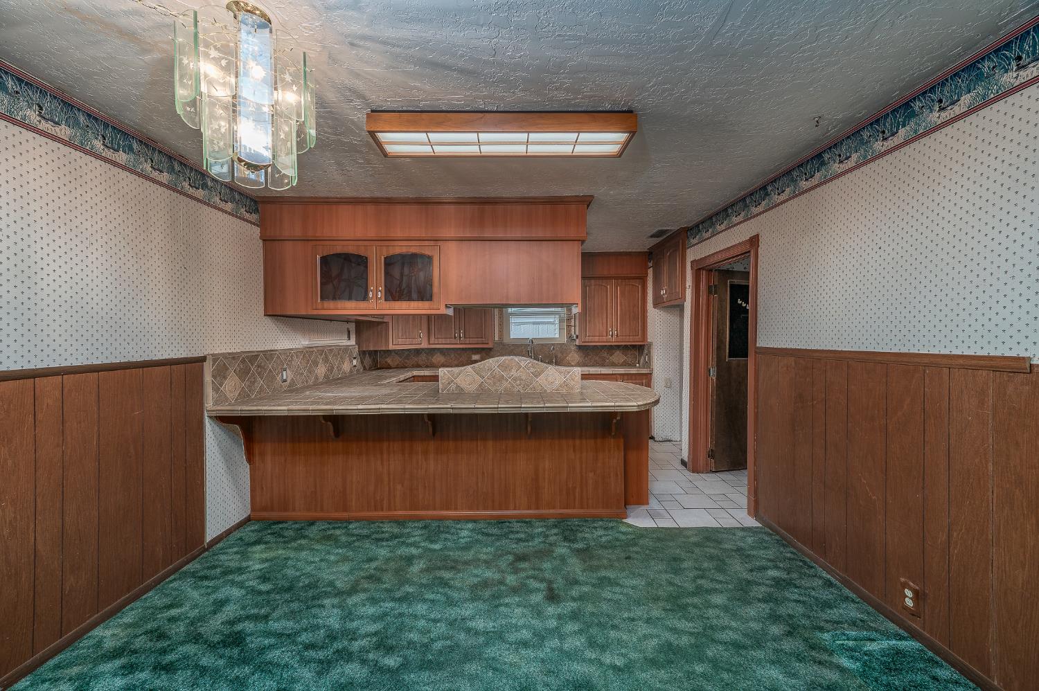 13230 4th Street Hickman, CA 95323 - Photo 34 of 54 a kitchen with granite countertop a stove a sink and a refrigerator
