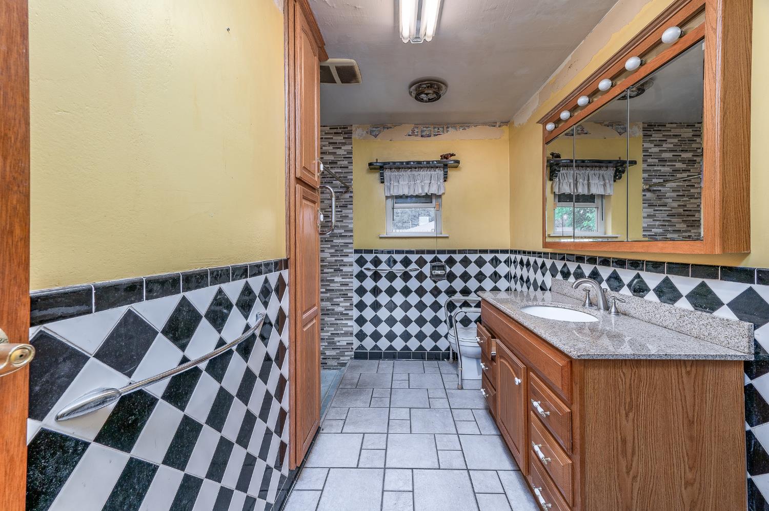 13230 4th Street Hickman, CA 95323 - Photo 48 of 54 a bathroom with a sink and a mirror
