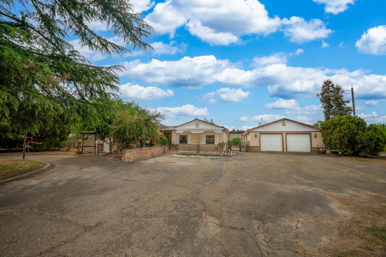 13230 4th Street Hickman, CA 95323 - Photo 5 of 54 a view of a house with a big yard plants and large trees