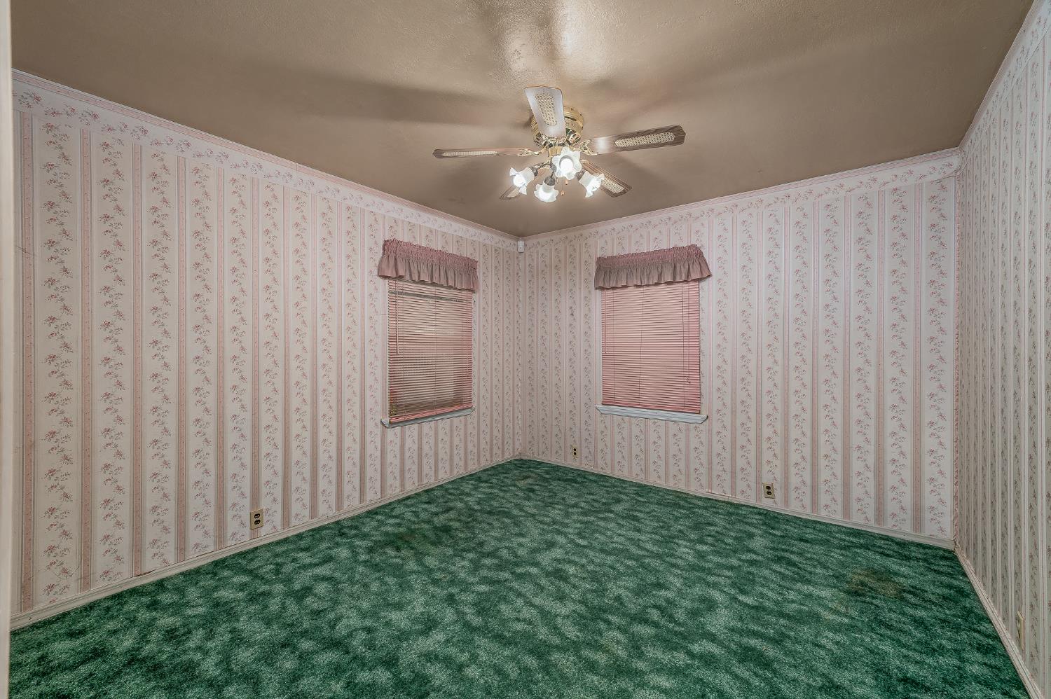 13230 4th Street Hickman, CA 95323 - Photo 53 of 54 a view of an empty room with chandelier fan and a window