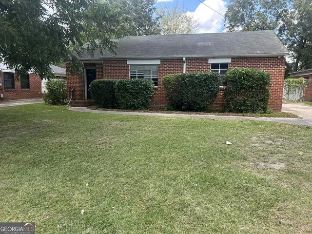 front view of a house with a yard