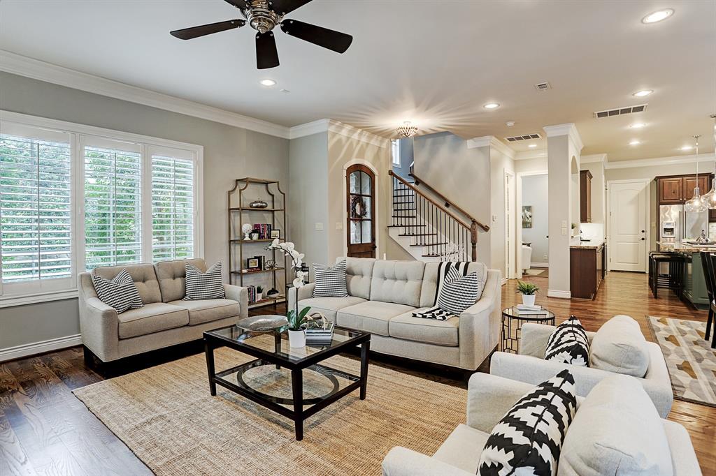 FRONT ENTRY AND LIVING ROOM 1402 Regalia Ct offers a substantially bright and open floorplan with a generous living space and all wood custom plantation shutters throughout the home.