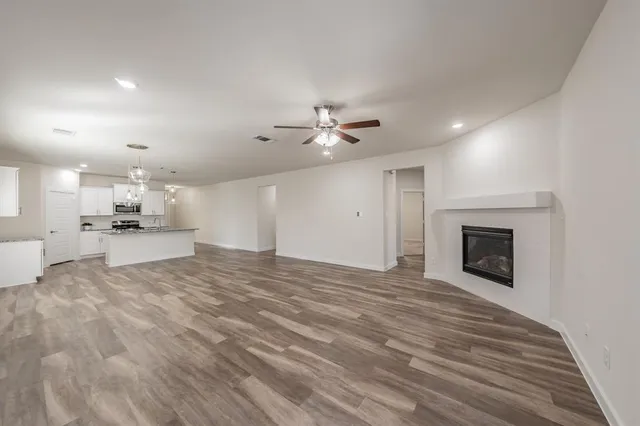 a view of a kitchen with a sink and a fireplace