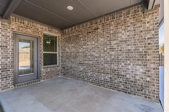 a view of a balcony with chairs