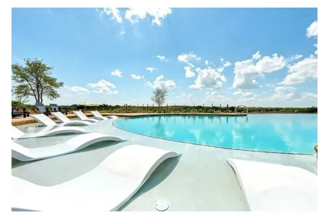 a view of a swimming pool with an outdoor space