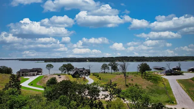 a view of a house with yard and sitting area