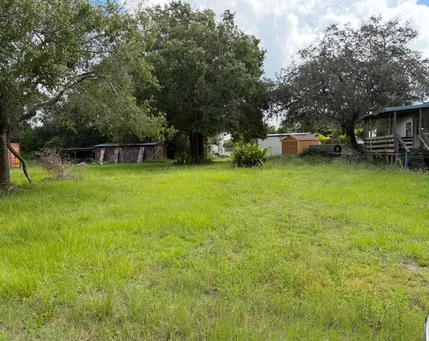 a view of a house with a big yard