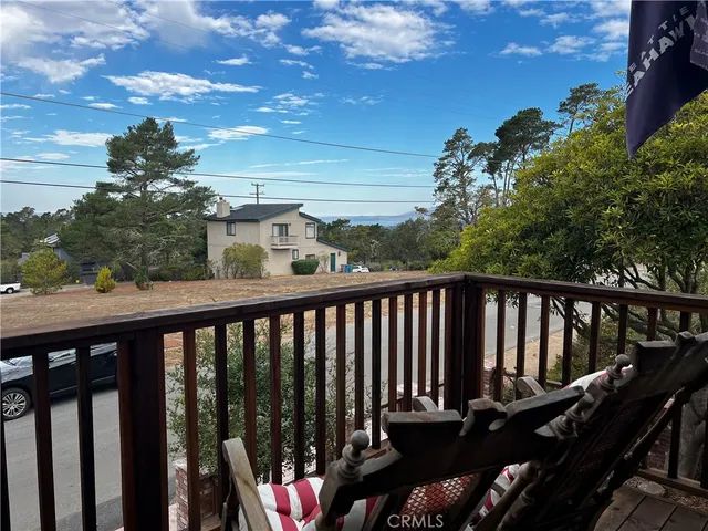 a bathroom with a glass shower door and a sink
