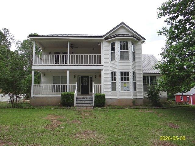 144 Old Sardis Church Road Clayton, AL 36016 - Photo 1 of 34 a front view of a house with a garden