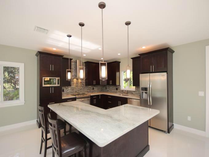 245 2nd Road Key Largo, FL 33037 - Photo 8 of 45 a kitchen with stainless steel appliances a table chairs and refrigerator