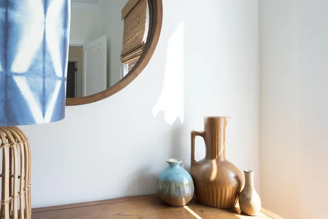 a view of a patio with table and chairs with wooden floor and fence