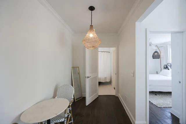 a living room with patio furniture and a large window
