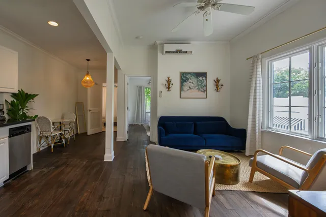 a view of a livingroom with furniture and window