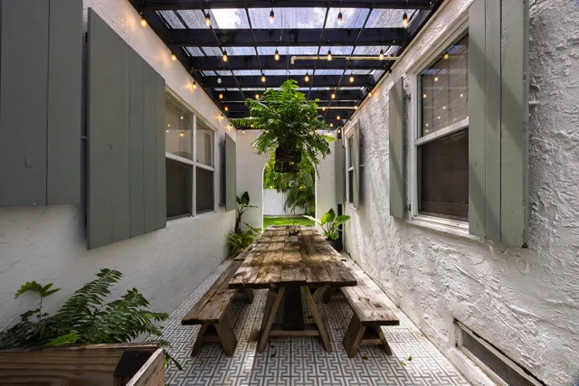 a living room with furniture fireplace and window