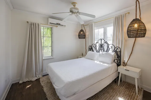 a dining room with furniture and wooden floor