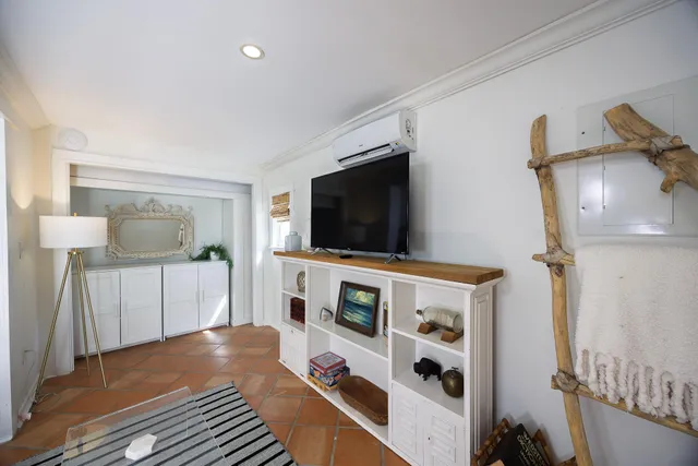 a kitchen with stainless steel appliances granite countertop a refrigerator and a counter top space