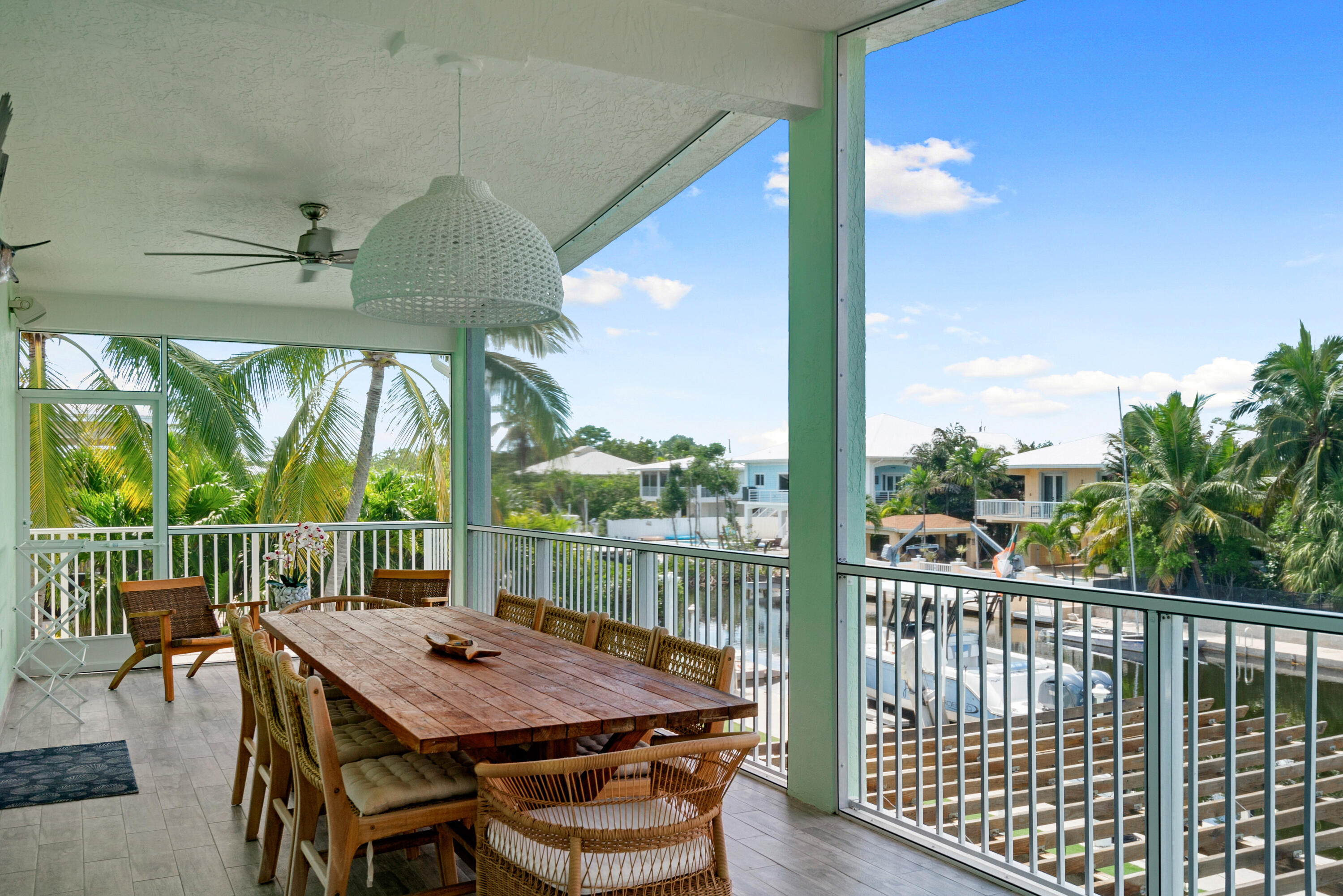 889 Ellen Drive Key Largo, FL 33037 - Photo 13 of 57 a view of a patio with a table chairs and a table