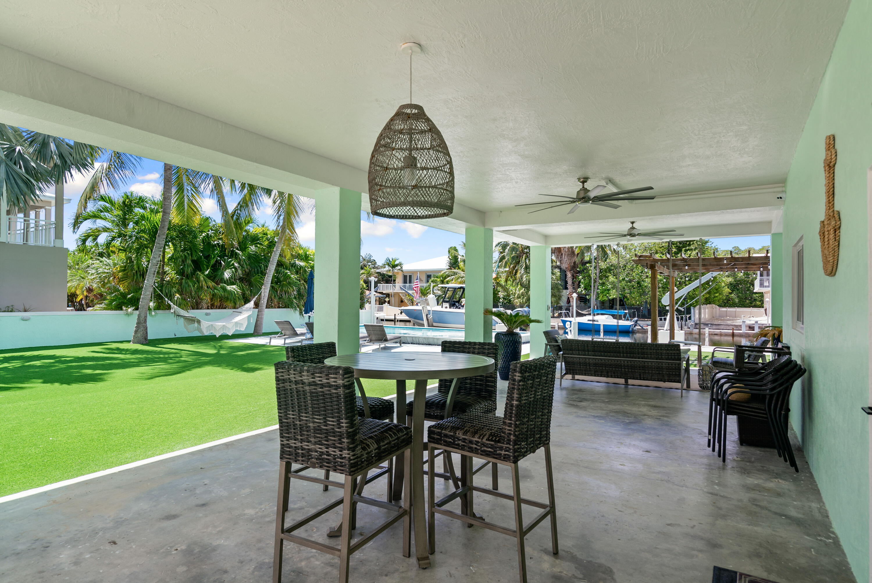 889 Ellen Drive Key Largo, FL 33037 - Photo 19 of 57 a dining room with furniture and a large window