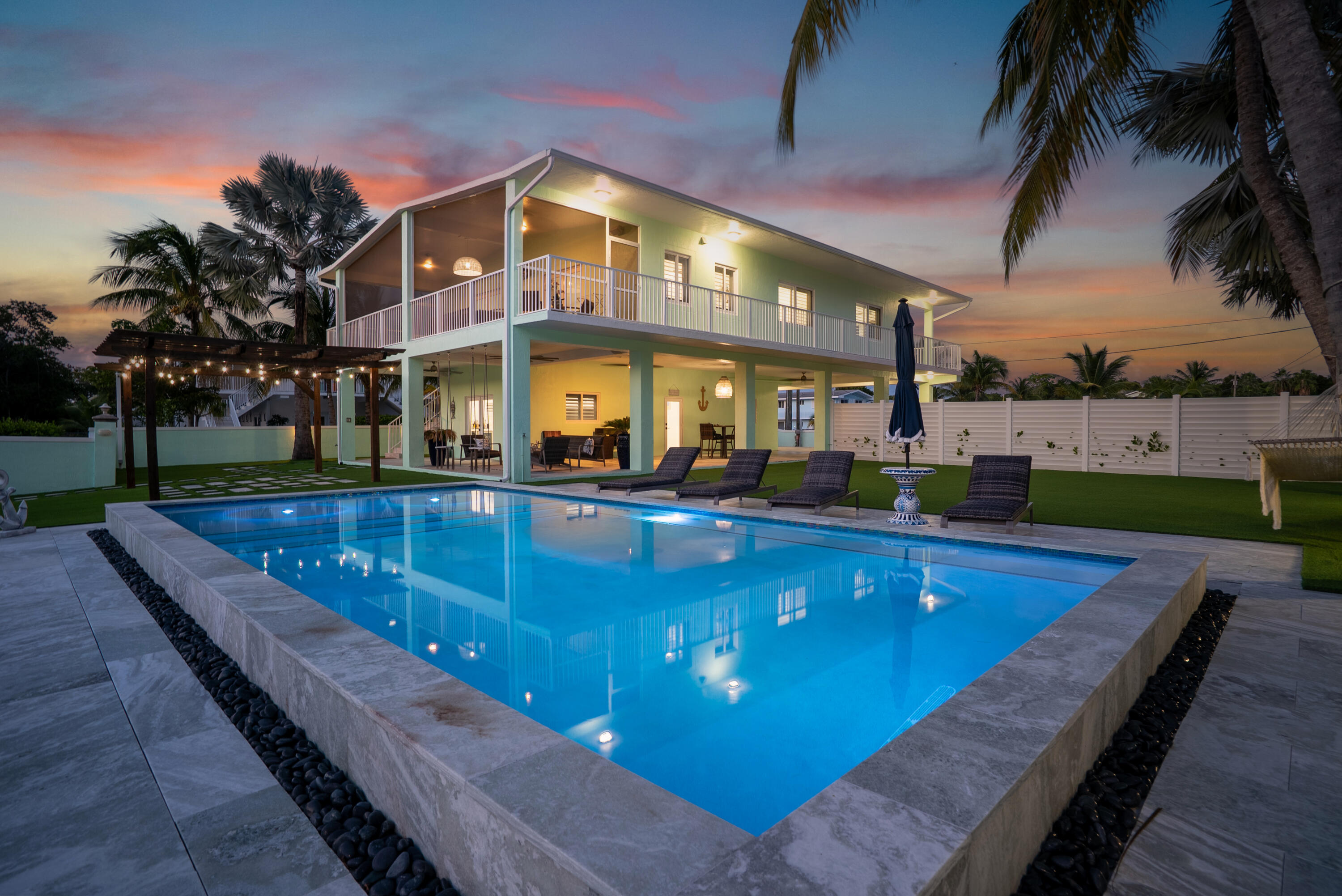 889 Ellen Drive Key Largo, FL 33037 - Photo 3 of 57 a view of a house with swimming pool