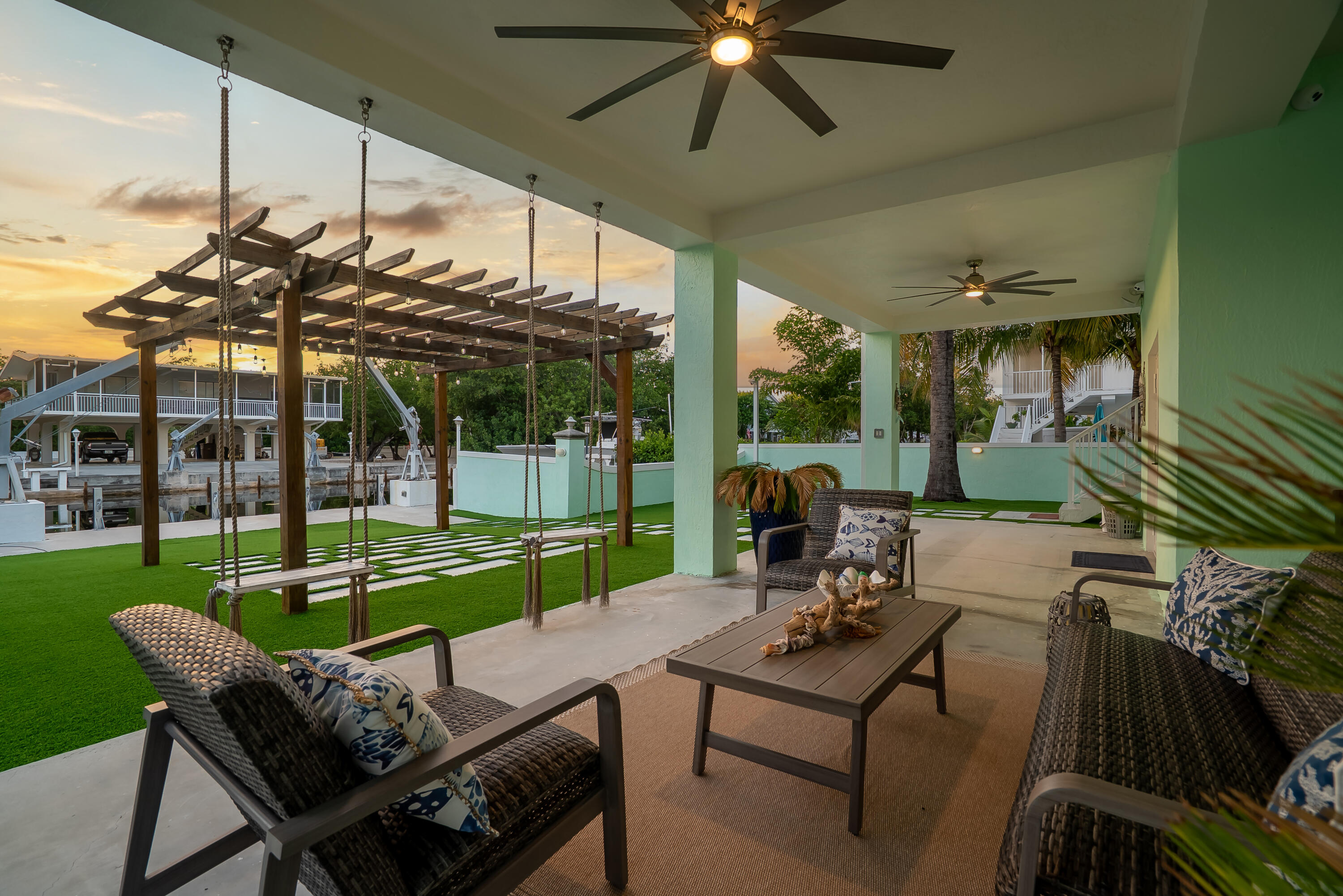 889 Ellen Drive Key Largo, FL 33037 - Photo 32 of 57 a view of a patio with a table chairs and a backyard