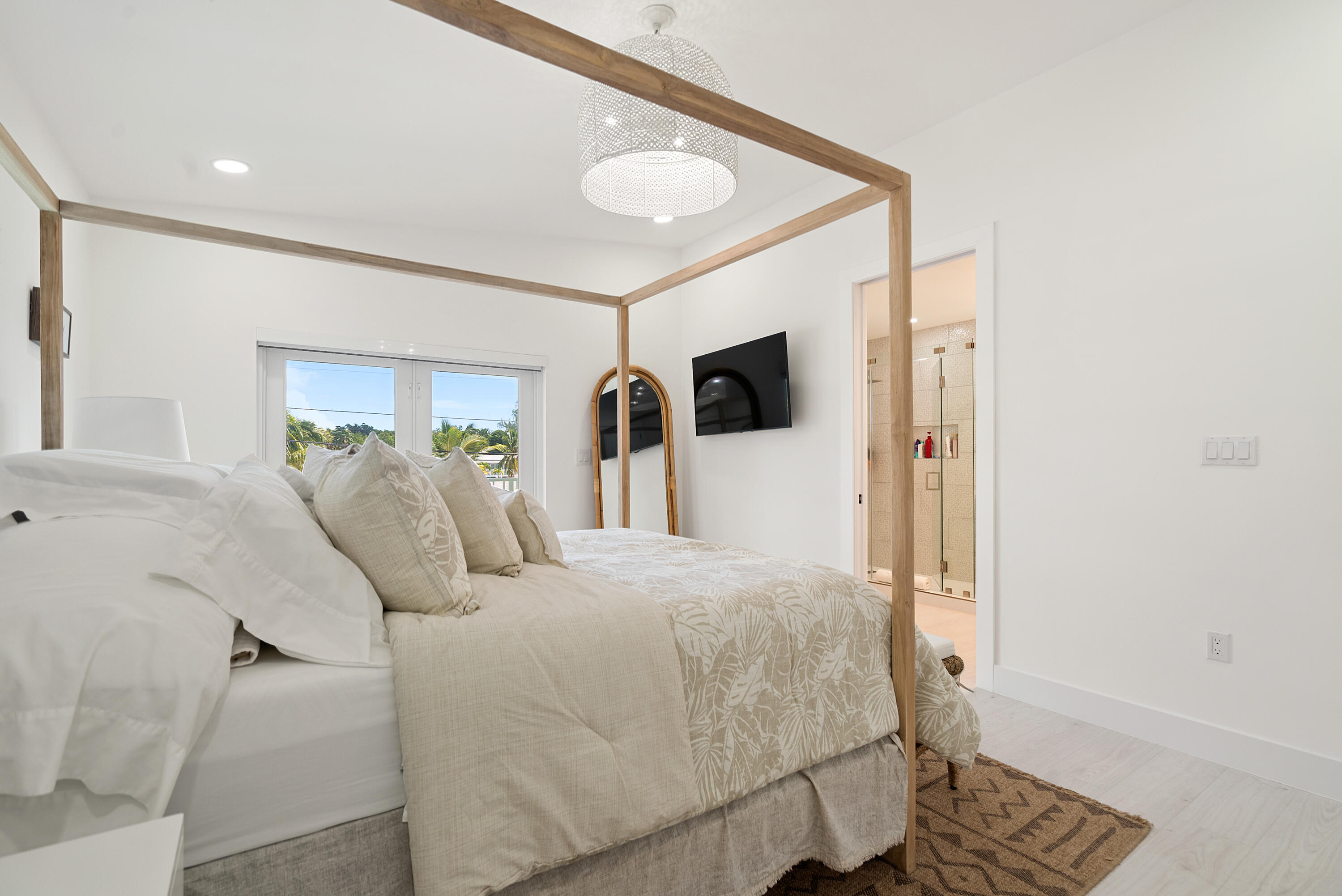 889 Ellen Drive Key Largo, FL 33037 - Photo 38 of 57 a bedroom with a bed and a flat screen tv