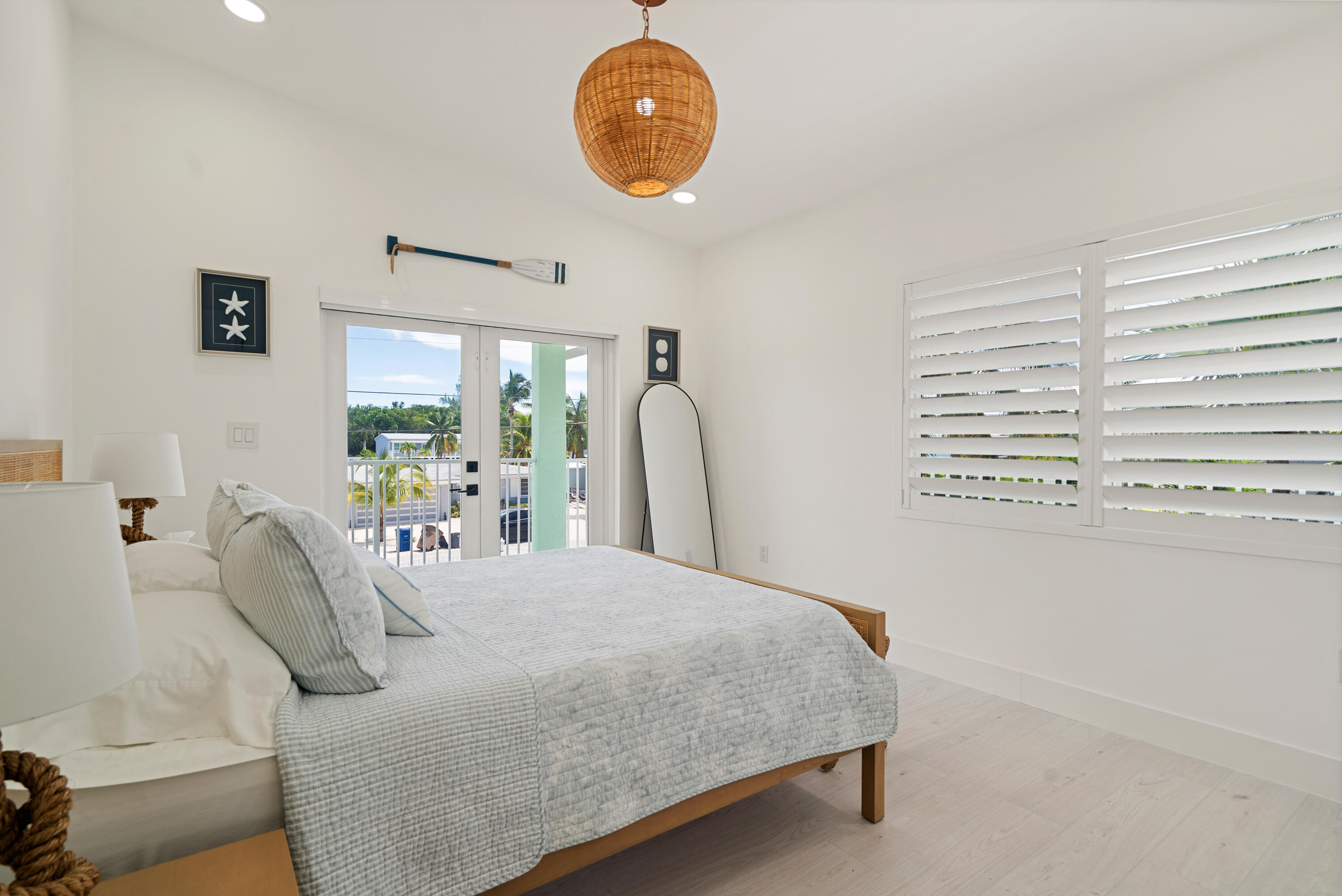 889 Ellen Drive Key Largo, FL 33037 - Photo 44 of 57 a bedroom with a bed and a large window