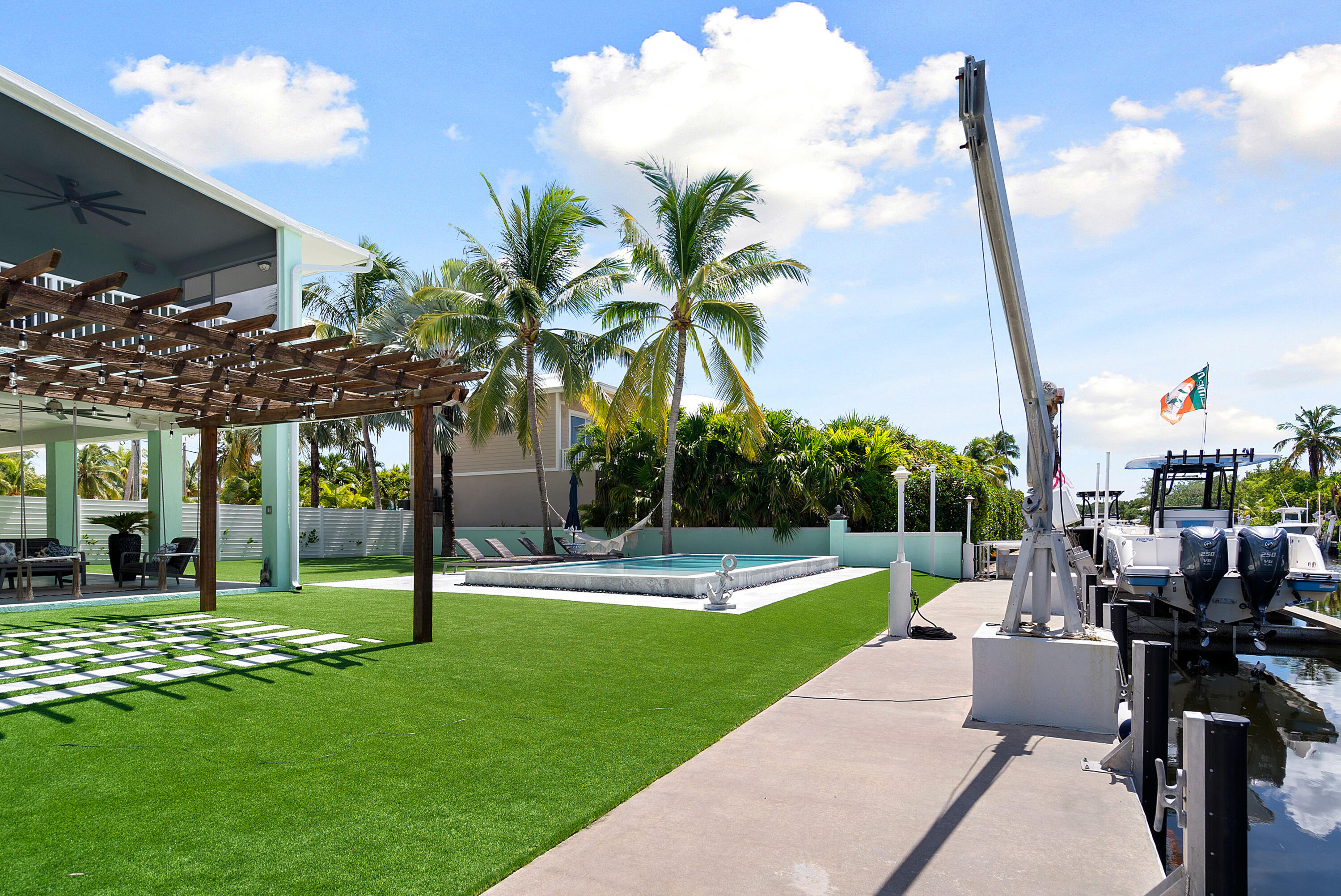 889 Ellen Drive Key Largo, FL 33037 - Photo 51 of 57 a view of a swimming pool with a patio