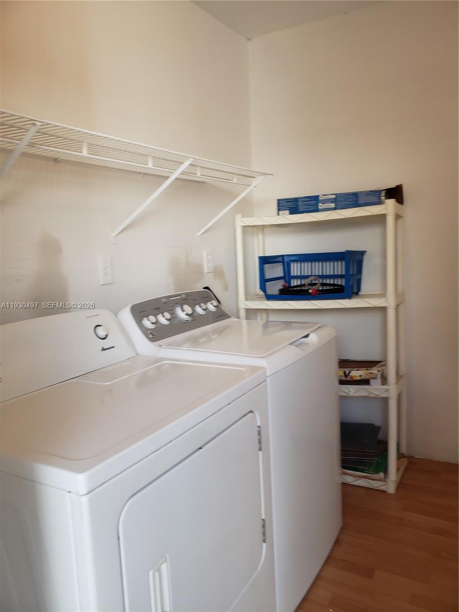 601 Ives Dairy Road, Unit 4058 Miami, FL 33179 - Photo 17 of 21 a utility room with dryer and washer