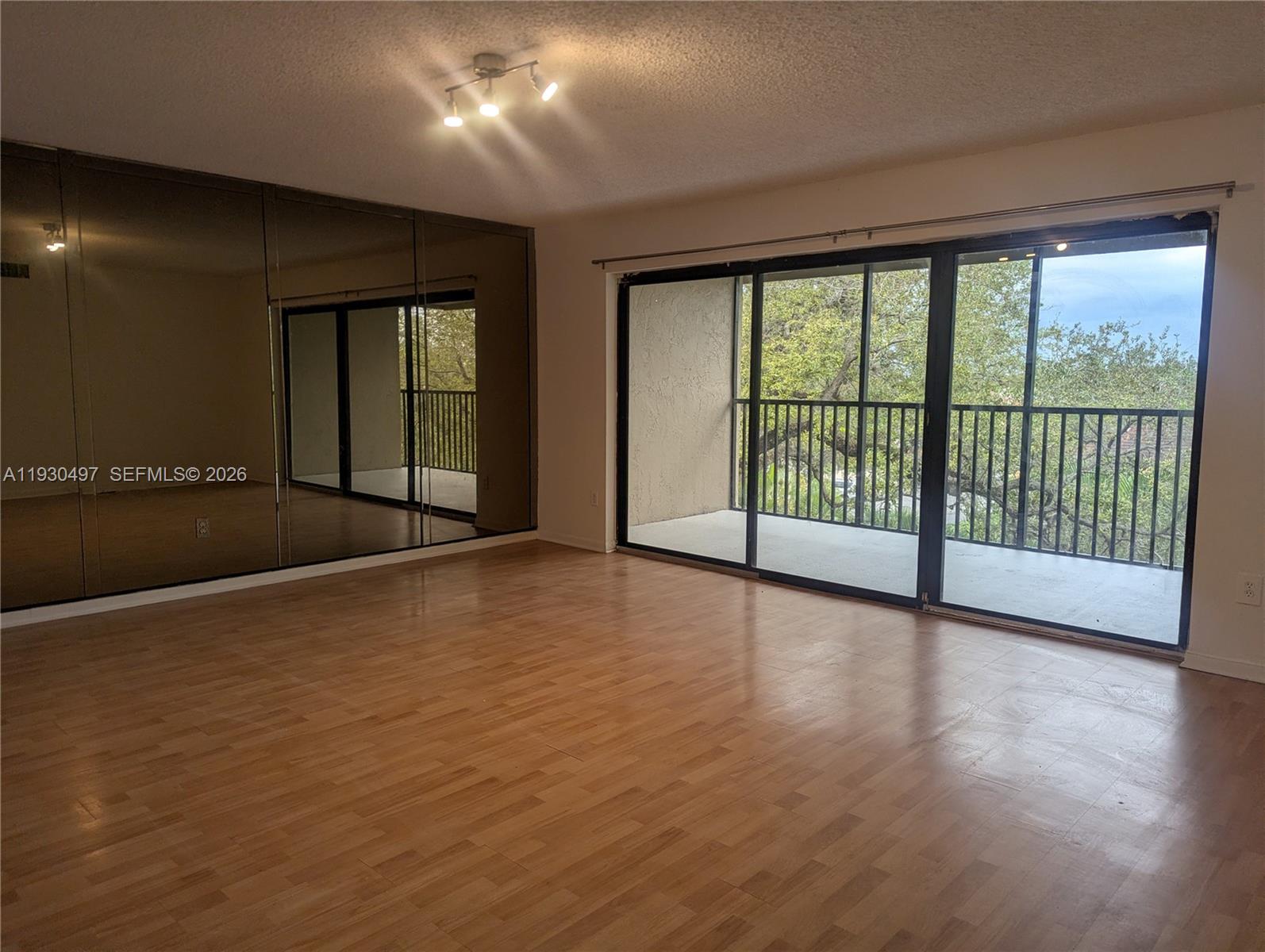601 Ives Dairy Road, Unit 4058 Miami, FL 33179 - Photo 4 of 21 a view of an empty room with glass door