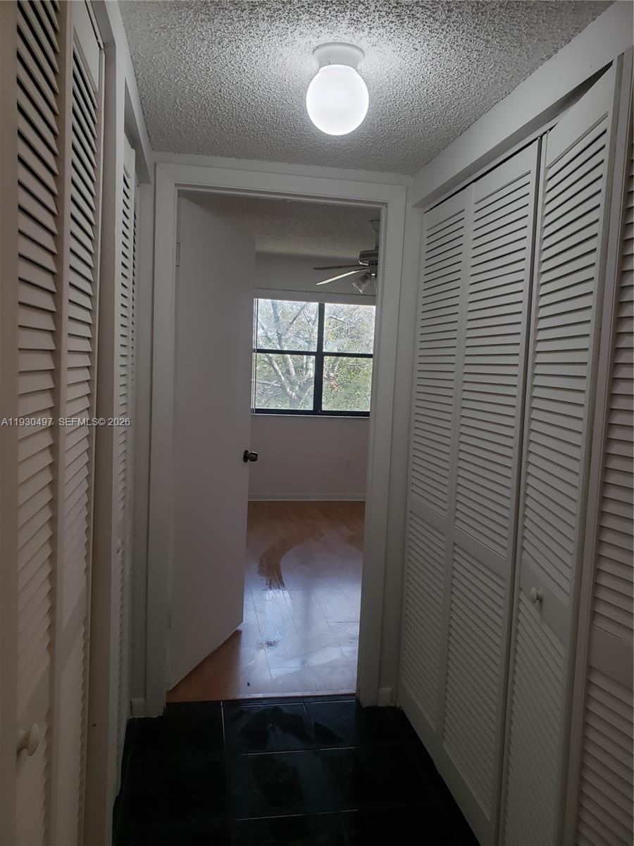 601 Ives Dairy Road, Unit 4058 Miami, FL 33179 - Photo 6 of 21 an empty room with windows