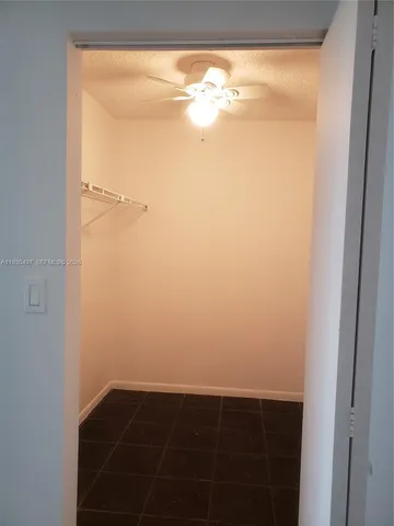 a bathroom with a toilet a sink and shower