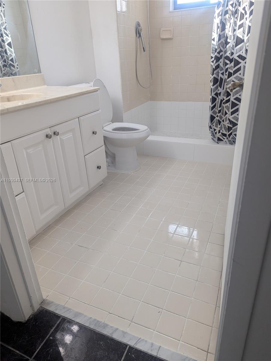601 Ives Dairy Road, Unit 4058 Miami, FL 33179 - Photo 10 of 21 a bathroom with a bathtub a toilet and a shower