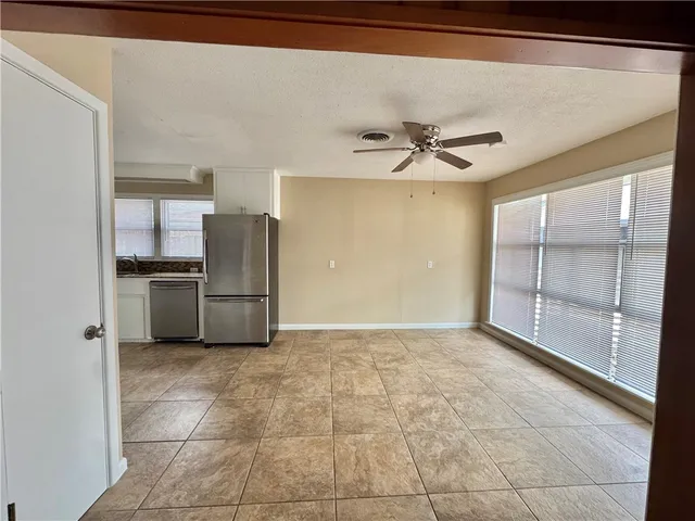 a view of a kitchen with a sink and a stove top oven
