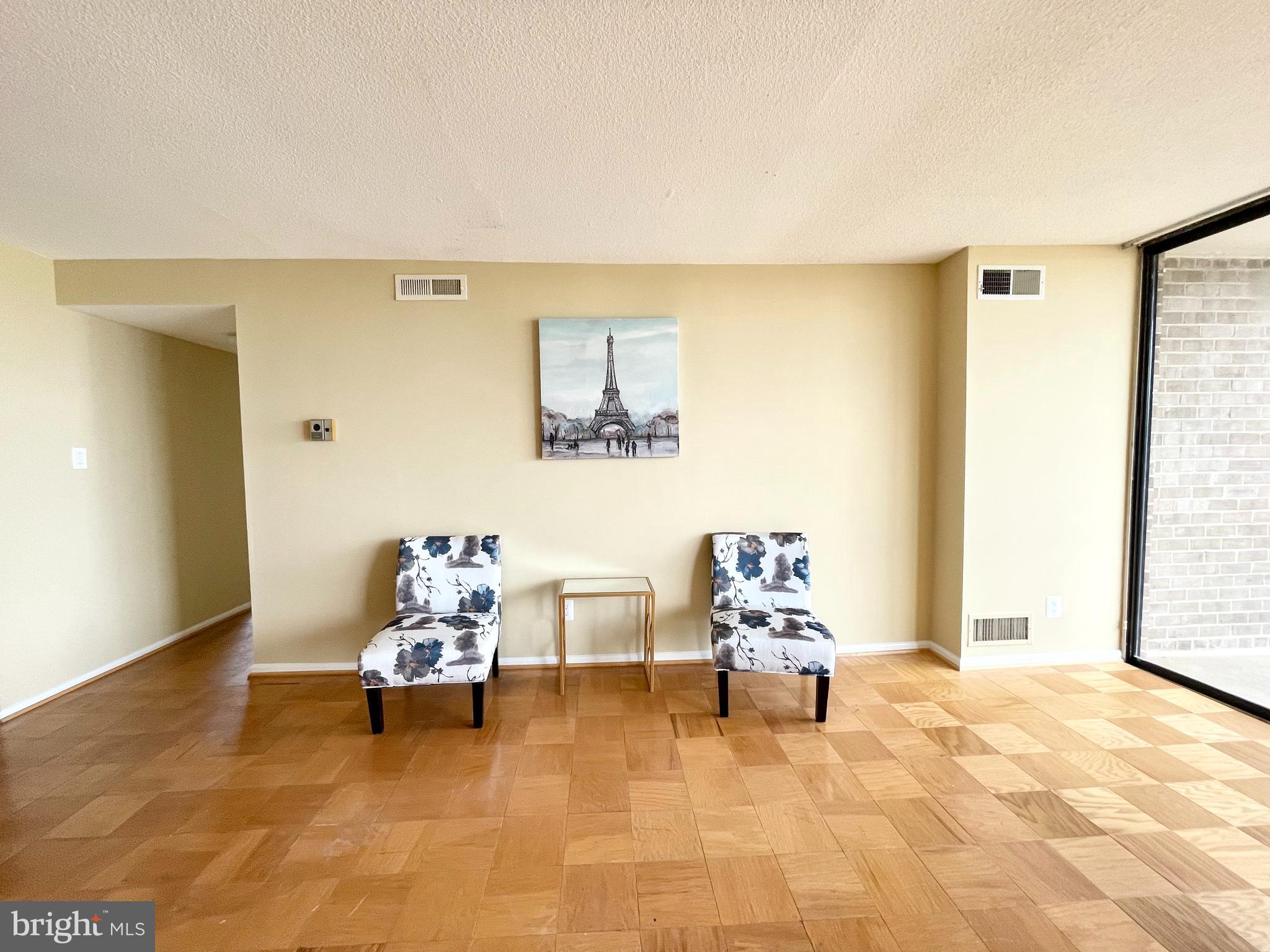 4 Monroe Street, Unit 802 Rockville, MD 20850 - Photo 19 of 44 a living room with furniture and white walls