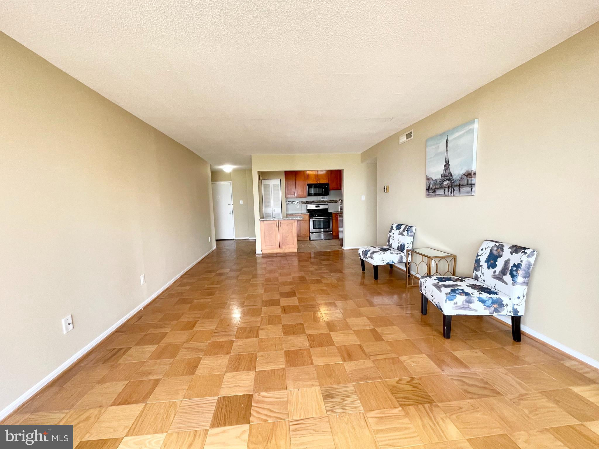 4 Monroe Street, Unit 802 Rockville, MD 20850 - Photo 21 of 44 a living room with furniture and a flat screen tv