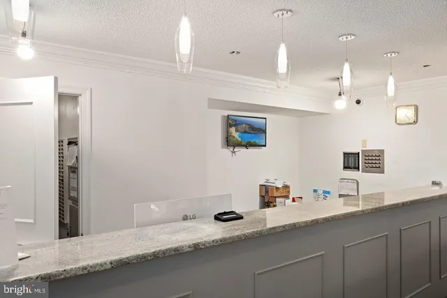 a bathroom with a sink double vanity granite and a mirror